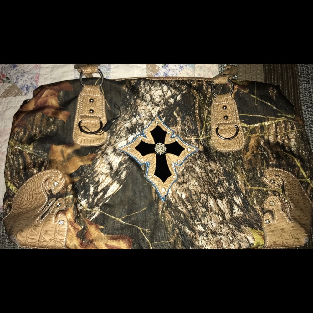 Overnight bag with cross embellishments